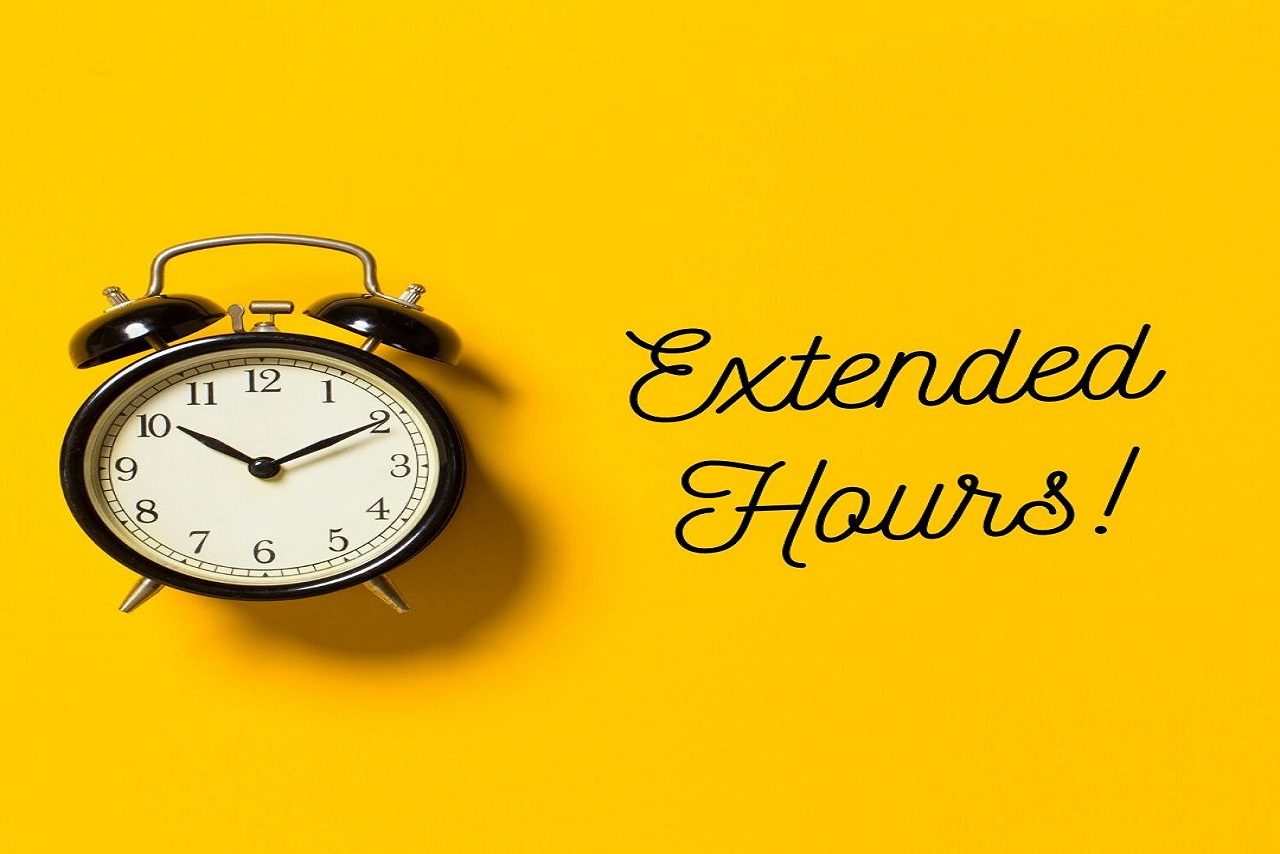 alarm clock next to words extended hours